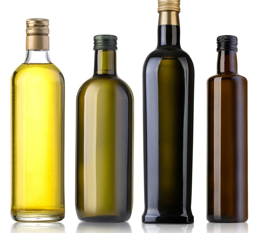 Four olive oil bottle in different colours representing olive oil quality and types. Bertolli Olive Oil.