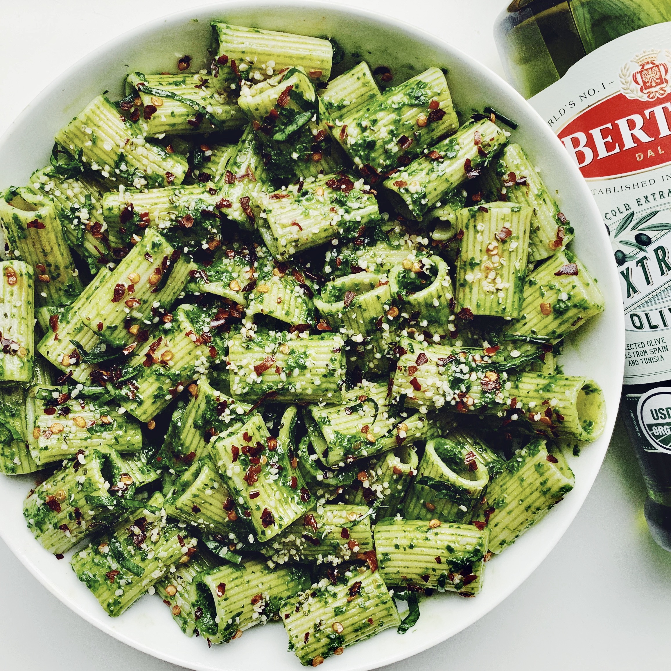 basil pistachio pesto pasta with Bertolli Olive Oil